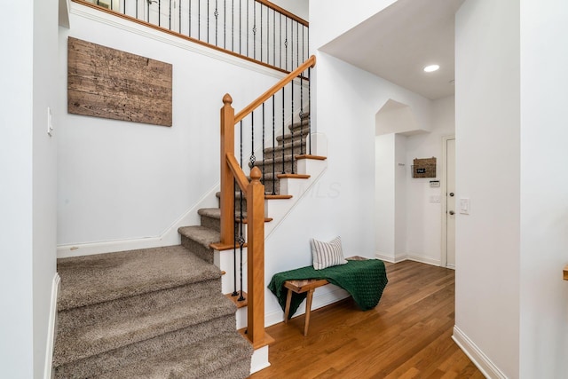 478 Riverbend Ave, Powell, OH 43065 - stairs with recessed lighting, wood finished floors, and baseboards