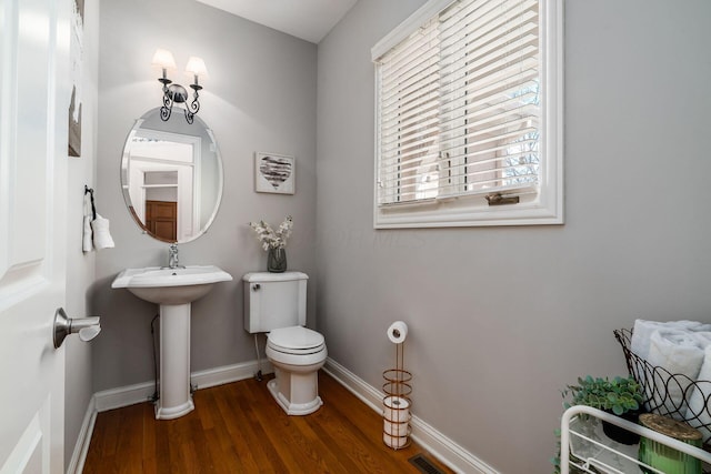478 Riverbend Ave, Powell, OH 43065 - bathroom with wood finished floors, a wealth of natural light, toilet, and baseboards