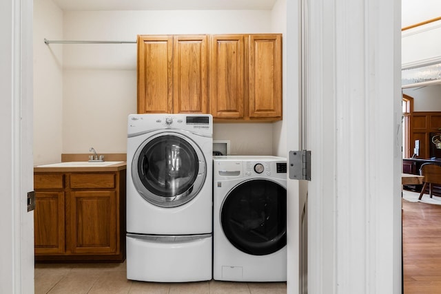 478 Riverbend Ave, Powell, OH 43065 - laundry area with a sink, independent washer and dryer, light tile patterned floors, and cabinet space