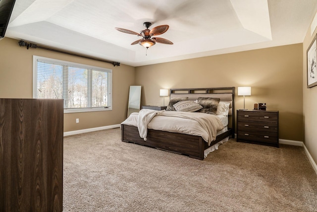 478 Riverbend Ave, Powell, OH 43065 - carpeted bedroom with ceiling fan, baseboards, and a raised ceiling