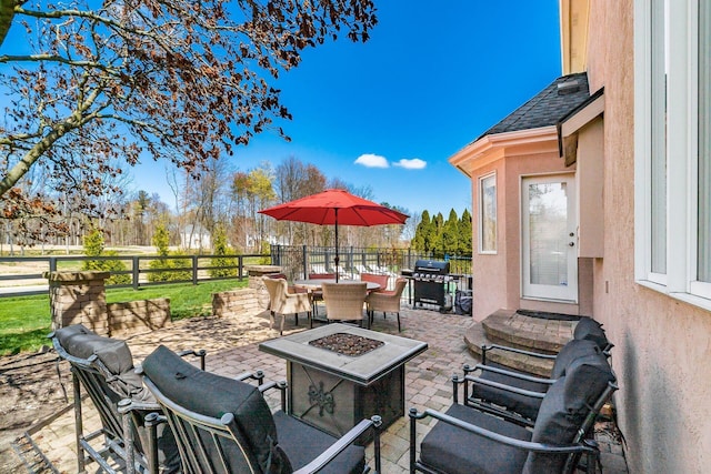 478 Riverbend Ave, Powell, OH 43065 - view of patio / terrace with a fire pit, fence, outdoor dining space, and a grill