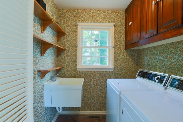 115 E Wheeling St, Lancaster, OH 43130 - laundry area featuring separate washer and dryer, wallpapered walls, baseboards, and cabinet space