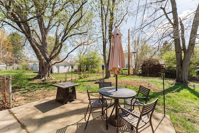 view of patio / terrace featuring fence and outdoor dining area