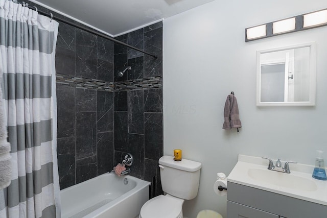 full bathroom with shower / bath combination with curtain, vanity, and toilet