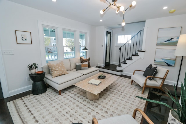 568 Cline St, Columbus, OH 43206 - living room with recessed lighting, wood finished floors, baseboards, a chandelier, and stairs