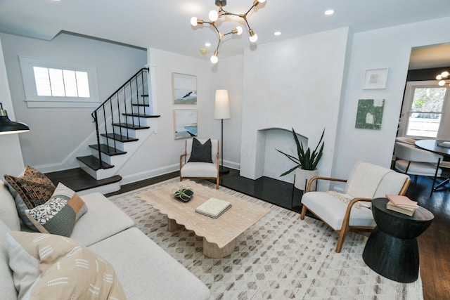 568 Cline St, Columbus, OH 43206 - living area featuring stairway, an inviting chandelier, wood finished floors, and recessed lighting