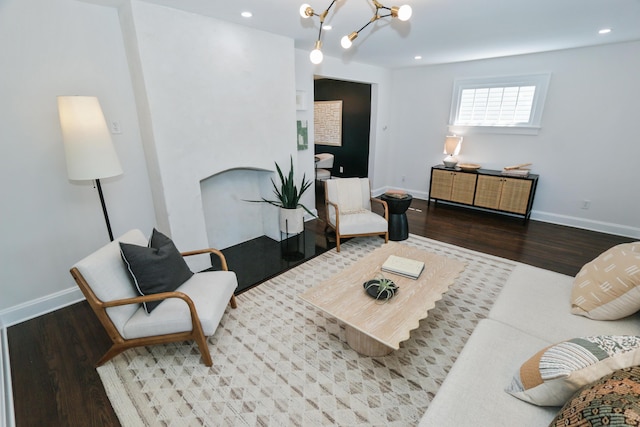 568 Cline St, Columbus, OH 43206 - living room featuring baseboards, wood finished floors, recessed lighting, and a notable chandelier