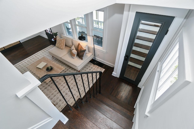 568 Cline St, Columbus, OH 43206 - stairs featuring baseboards, a healthy amount of sunlight, and wood finished floors