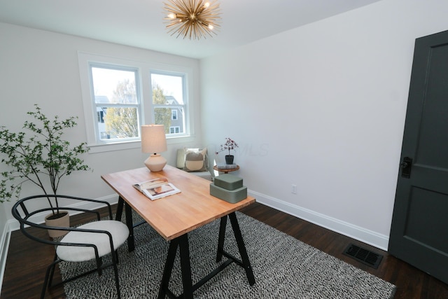 568 Cline St, Columbus, OH 43206 - home office featuring an inviting chandelier, dark wood-type flooring, visible vents, and baseboards