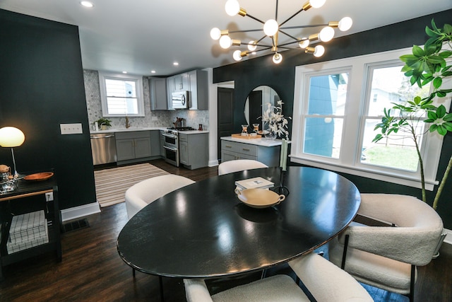 568 Cline St, Columbus, OH 43206 - dining room featuring dark wood finished floors, a notable chandelier, visible vents, and recessed lighting