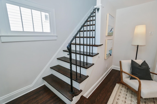 568 Cline St, Columbus, OH 43206 - staircase featuring wood finished floors, a healthy amount of sunlight, and baseboards