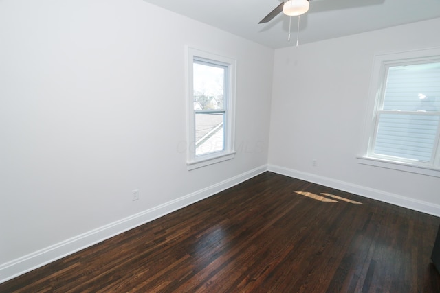 568 Cline St, Columbus, OH 43206 - spare room with baseboards, a ceiling fan, and dark wood-style floors