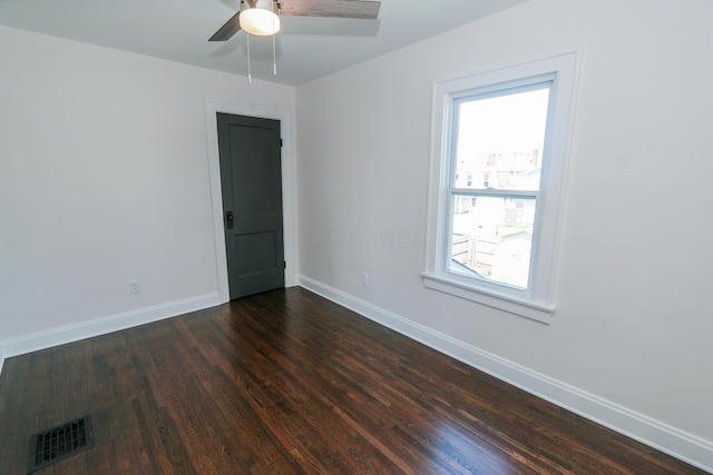 568 Cline St, Columbus, OH 43206 - spare room featuring dark wood finished floors, baseboards, visible vents, and plenty of natural light