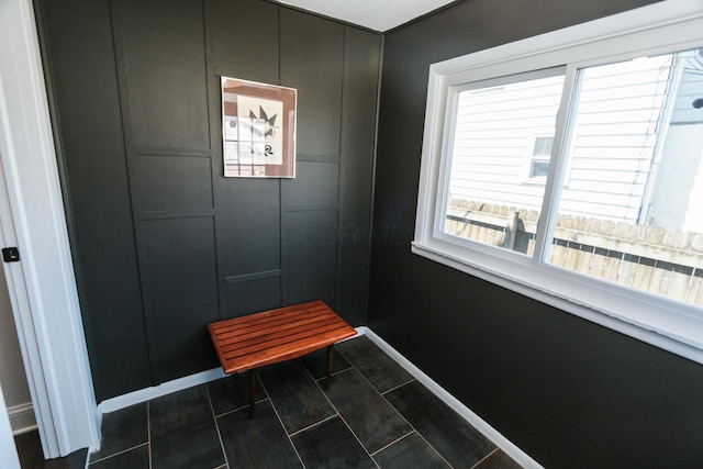 568 Cline St, Columbus, OH 43206 - mudroom with baseboards and dark tile patterned floors