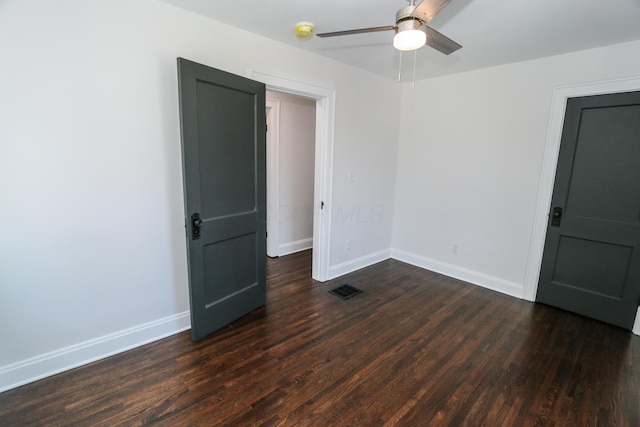 568 Cline St, Columbus, OH 43206 - empty room featuring dark wood-style flooring, a ceiling fan, visible vents, and baseboards