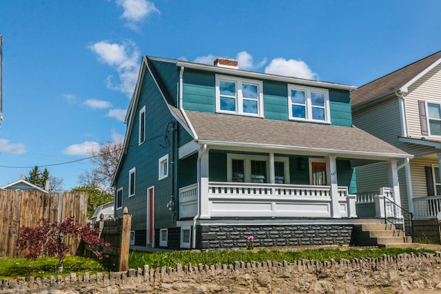 568 Cline St, Columbus, OH 43206 - view of front facade featuring roof with shingles, a chimney, covered porch, and fence