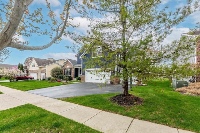 8181 Trail Lake Dr, Powell, OH 43065 - view of front of house with an attached garage, a front lawn, and driveway