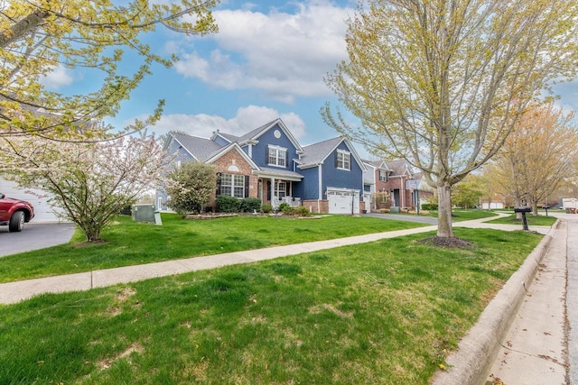 8181 Trail Lake Dr, Powell, OH 43065 - traditional-style house with an attached garage, brick siding, and a front yard