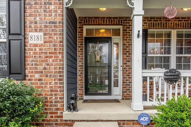 8181 Trail Lake Dr, Powell, OH 43065 - property entrance featuring a porch and brick siding