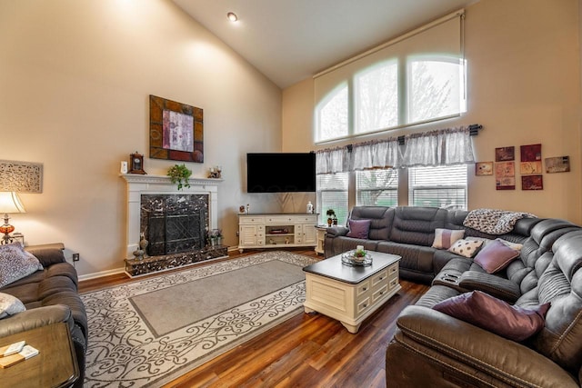 8181 Trail Lake Dr, Powell, OH 43065 - living area with a premium fireplace, high vaulted ceiling, and dark wood-type flooring