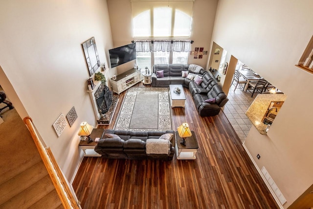 8181 Trail Lake Dr, Powell, OH 43065 - living area featuring wood finished floors and a towering ceiling