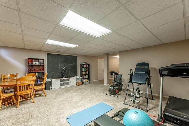 8181 Trail Lake Dr, Powell, OH 43065 - workout room featuring carpet floors, a paneled ceiling, and baseboards