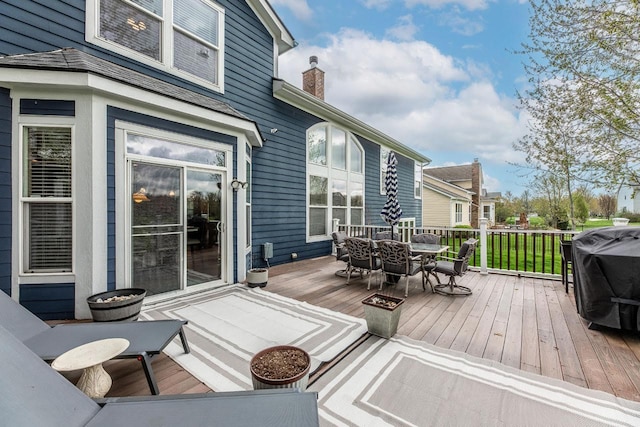 8181 Trail Lake Dr, Powell, OH 43065 - wooden deck with grilling area and outdoor dining space