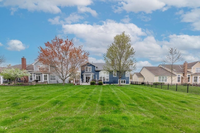 8181 Trail Lake Dr, Powell, OH 43065 - rear view of house with a lawn and fence