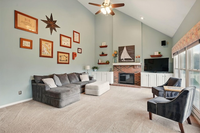 living area featuring high vaulted ceiling, ceiling fan, a brick fireplace, baseboards, and carpet flooring