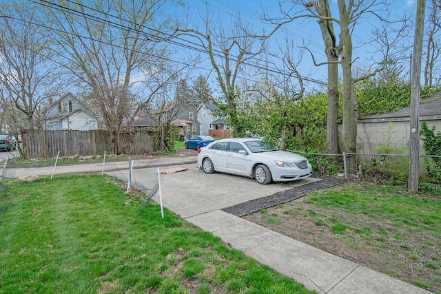 view of street featuring concrete driveway