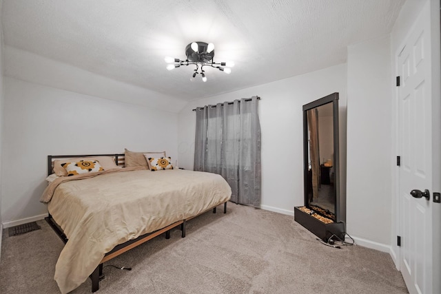 bedroom featuring baseboards and carpet