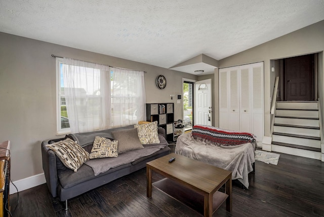 2495 Hingham Ln, Columbus, OH 43224 - living room featuring plenty of natural light, a textured ceiling, wood finished floors, lofted ceiling, and stairs