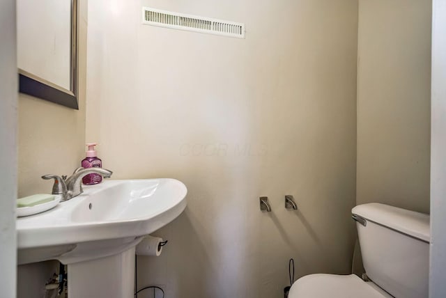 2495 Hingham Ln, Columbus, OH 43224 - half bath with toilet and a sink