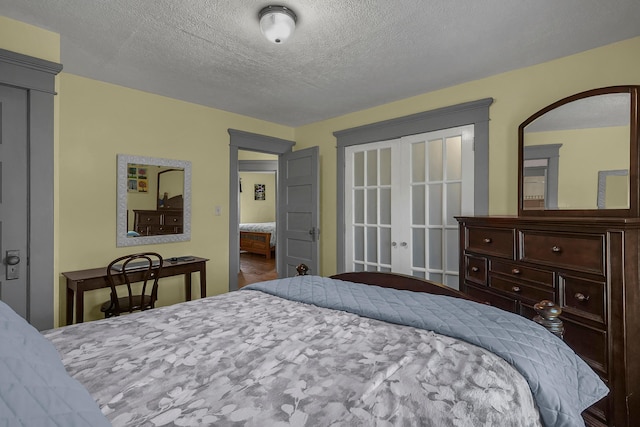 117 Fairfield Ave, Newark, OH 43055 - bedroom featuring a textured ceiling and french doors