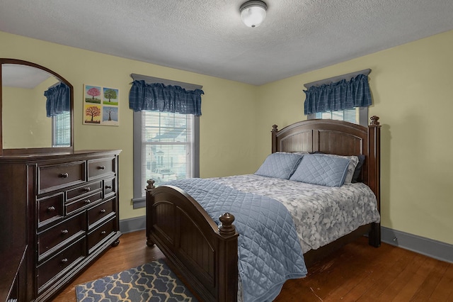 117 Fairfield Ave, Newark, OH 43055 - bedroom with baseboards, dark wood-type flooring, and a textured ceiling