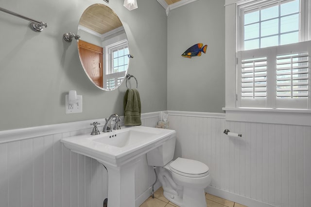 117 Fairfield Ave, Newark, OH 43055 - bathroom featuring tile patterned flooring, a wainscoted wall, ornamental molding, and toilet