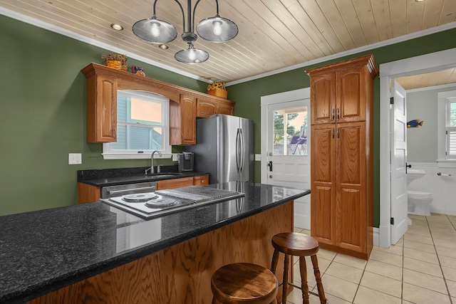 117 Fairfield Ave, Newark, OH 43055 - kitchen with ornamental molding, light tile patterned floors, a sink, freestanding refrigerator, and wood ceiling