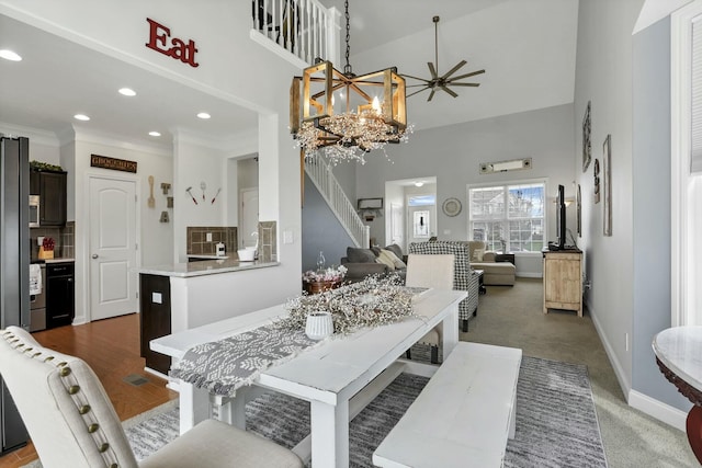 114 Hummock Dr, Etna, OH 43062 - carpeted dining area featuring baseboards, a towering ceiling, recessed lighting, and stairway