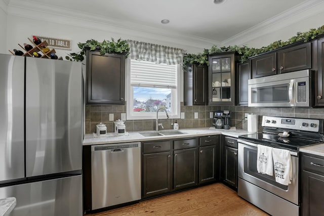 114 Hummock Dr, Etna, OH 43062 - kitchen featuring stainless steel appliances, a sink, backsplash, and crown molding