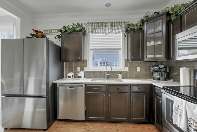 114 Hummock Dr, Etna, OH 43062 - kitchen with appliances with stainless steel finishes, dark brown cabinets, and a sink