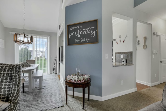 114 Hummock Dr, Etna, OH 43062 - hallway featuring a chandelier, carpet, and baseboards