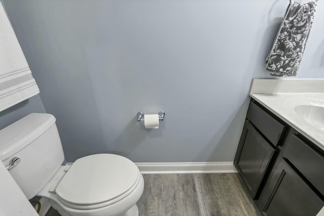 114 Hummock Dr, Etna, OH 43062 - bathroom with wood finished floors, baseboards, vanity, and toilet