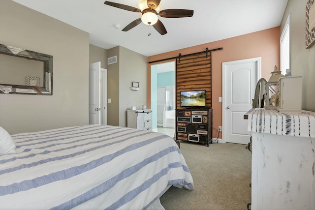 114 Hummock Dr, Etna, OH 43062 - carpeted bedroom with a barn door, visible vents, and ceiling fan