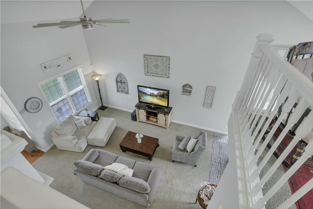 114 Hummock Dr, Etna, OH 43062 - living room with stairway, carpet, a towering ceiling, a ceiling fan, and baseboards