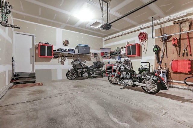 114 Hummock Dr, Etna, OH 43062 - garage featuring a garage door opener