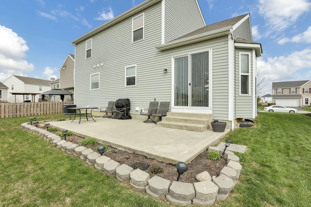 114 Hummock Dr, Etna, OH 43062 - rear view of house featuring central AC, a lawn, fence, a patio, and entry steps