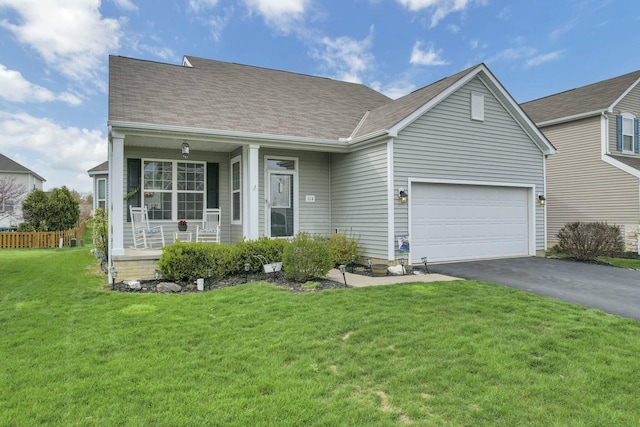 114 Hummock Dr, Etna, OH 43062 - view of front facade featuring a front lawn, aphalt driveway, a shingled roof, an attached garage, and a porch