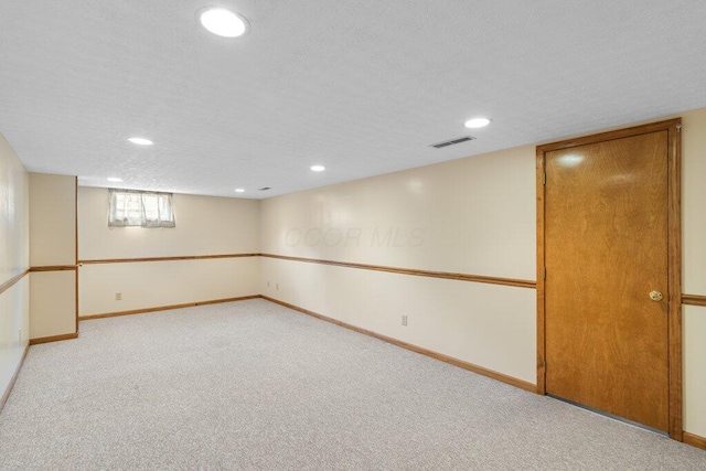 basement with recessed lighting, baseboards, and carpet floors