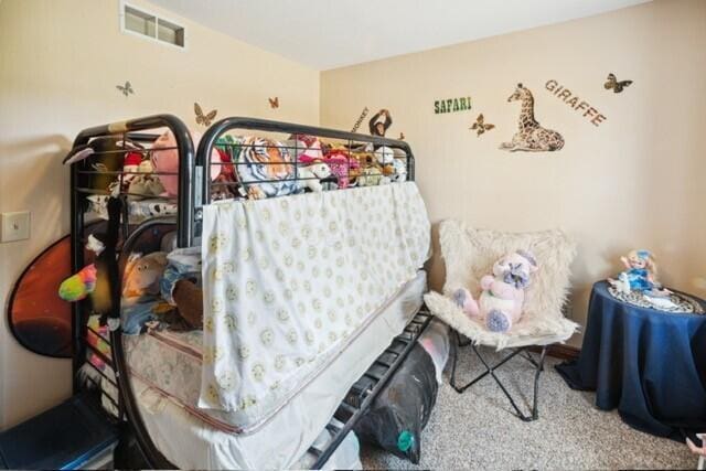 bedroom with visible vents