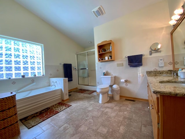 bathroom featuring a shower stall, visible vents, a garden tub, and toilet
